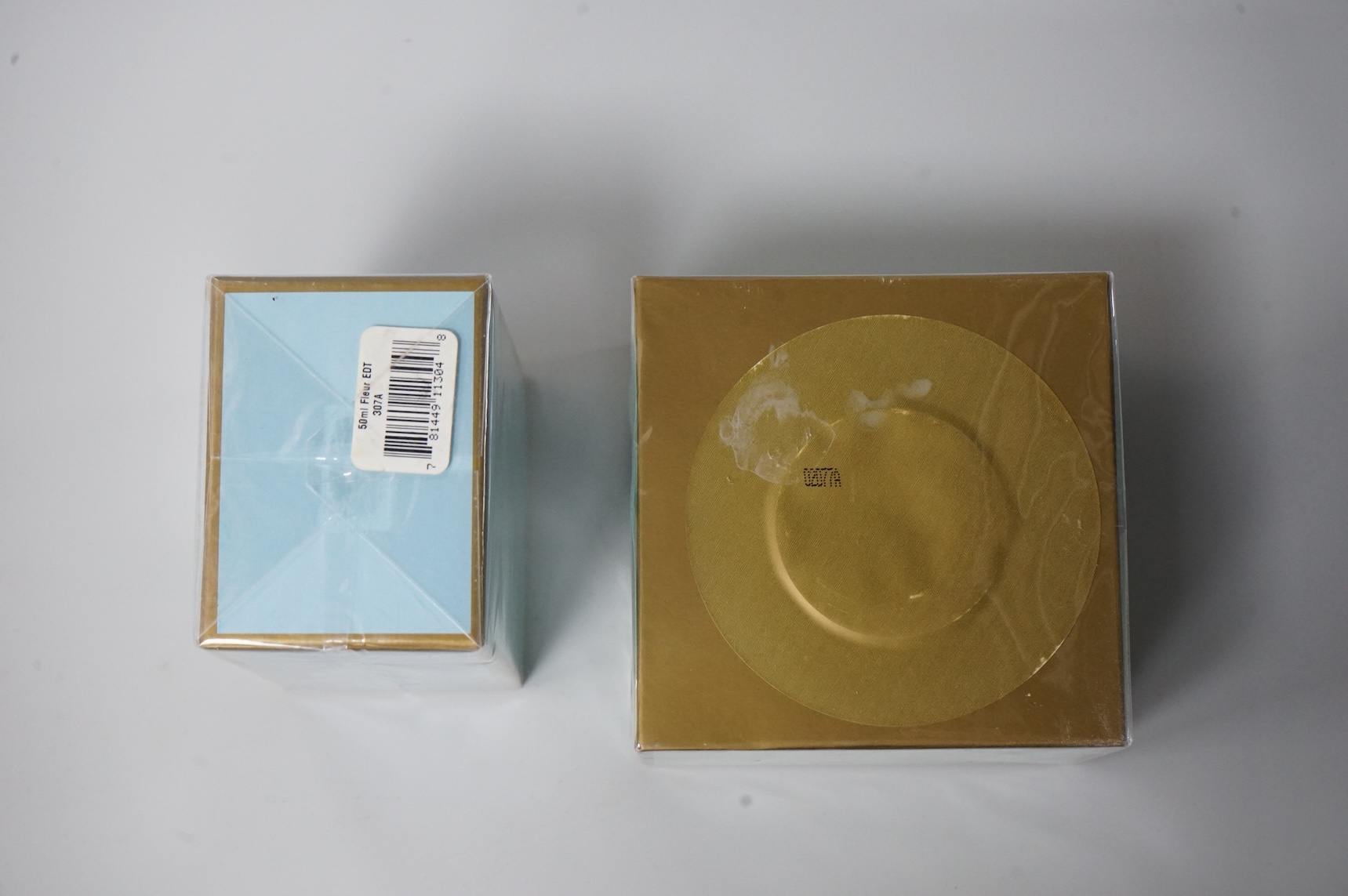 Three bottle of ladies unopened Floris perfumes comprising two bottles of Fleur and one bottle of Special No. 127, together with Floris Lily of the Valley silken dusting powder, each boxed and cellophane wrapped
